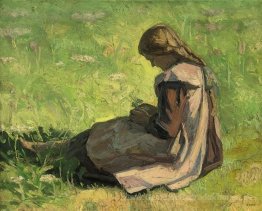 Mädchen, das im Gras sitzt