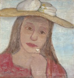 Junges Mädchen mit Strohhut und eine Blume in der Hand